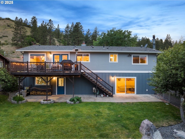 99 Walnut St, La Grande, OR 97850 - back of property with stairway, a patio, a deck, and a lawn