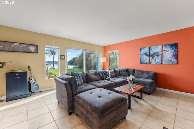 601 N Tomahawk Island Dr, Portland, OR 97217 - living room with baseboards, light tile patterned flooring, and a healthy amount of sunlight