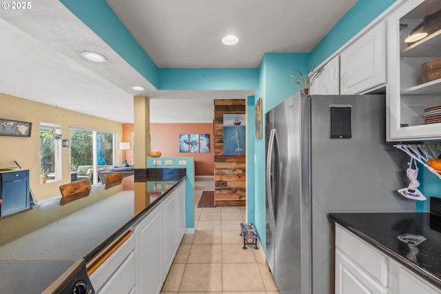 601 N Tomahawk Island Dr, Portland, OR 97217 - kitchen featuring recessed lighting, glass insert cabinets, white cabinetry, freestanding refrigerator, and dark countertops