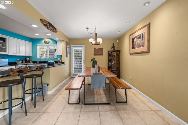 601 N Tomahawk Island Dr, Portland, OR 97217 - dining space featuring a chandelier, light tile patterned floors, baseboards, and recessed lighting