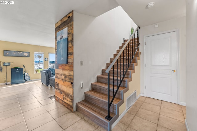601 N Tomahawk Island Dr, Portland, OR 97217 - stairway with tile patterned floors, visible vents, and baseboards