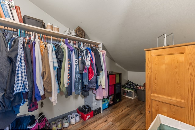 601 N Tomahawk Island Dr, Portland, OR 97217 - walk in closet with vaulted ceiling and wood finished floors