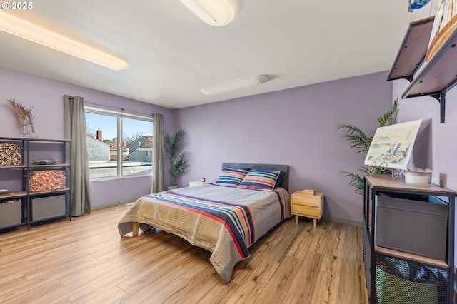 601 N Tomahawk Island Dr, Portland, OR 97217 - bedroom featuring light wood-style floors and baseboards