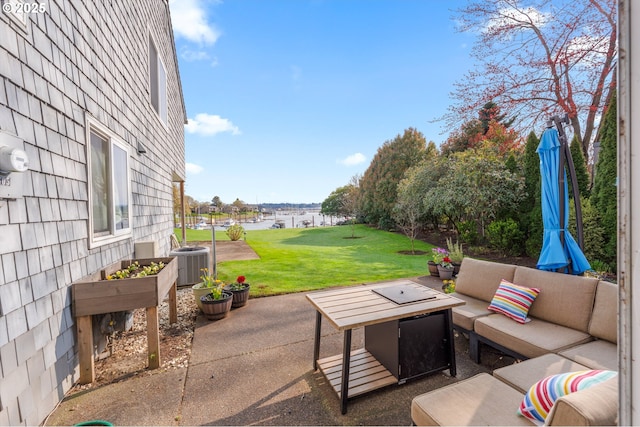 601 N Tomahawk Island Dr, Portland, OR 97217 - view of patio with cooling unit, an outdoor hangout area, and a water view
