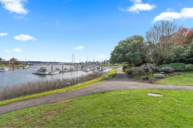 601 N Tomahawk Island Dr, Portland, OR 97217 - dock area with a water view and a yard