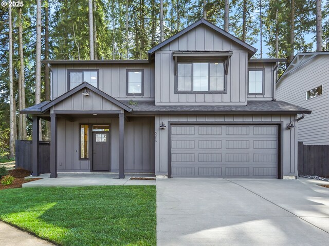 view of front facade featuring fence, roof with shingles, a garage, a front yard, and concrete driveway