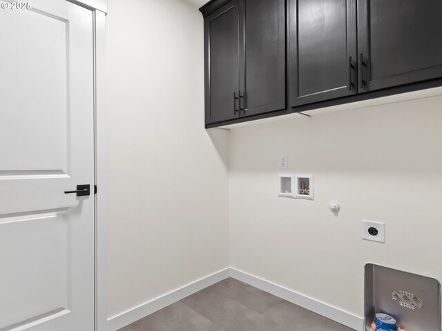 clothes washing area featuring washer hookup, electric dryer hookup, hookup for a gas dryer, cabinet space, and baseboards