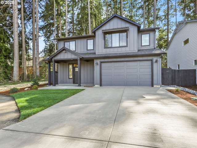 view of front of home featuring board and batten siding, a porch, driveway, a garage, and fence