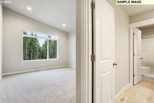 kitchen with light wood-style flooring, a peninsula, light countertops, appliances with stainless steel finishes, and tasteful backsplash