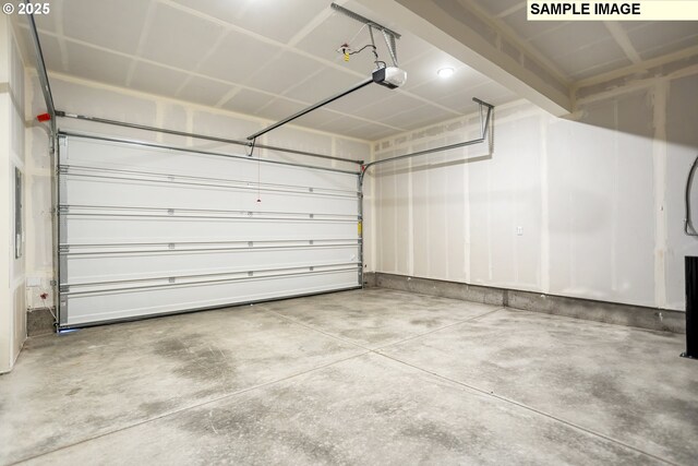 unfurnished bedroom featuring light carpet, a closet, a walk in closet, and baseboards