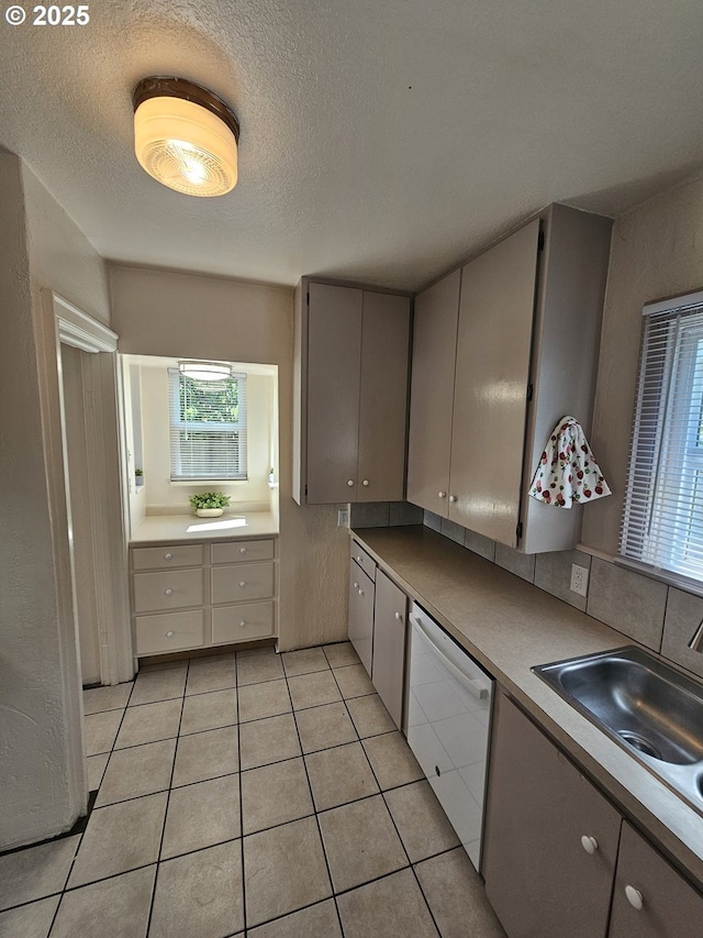 1760 W Broadway, Eugene, OR 97402 - kitchen with dishwasher, light tile patterned floors, a textured ceiling, and gray cabinets