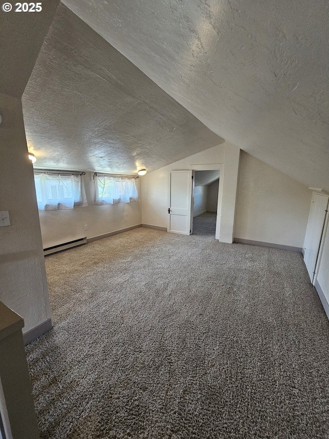 1760 W Broadway, Eugene, OR 97402 - bonus room with a baseboard heating unit, a textured ceiling, carpet floors, and vaulted ceiling