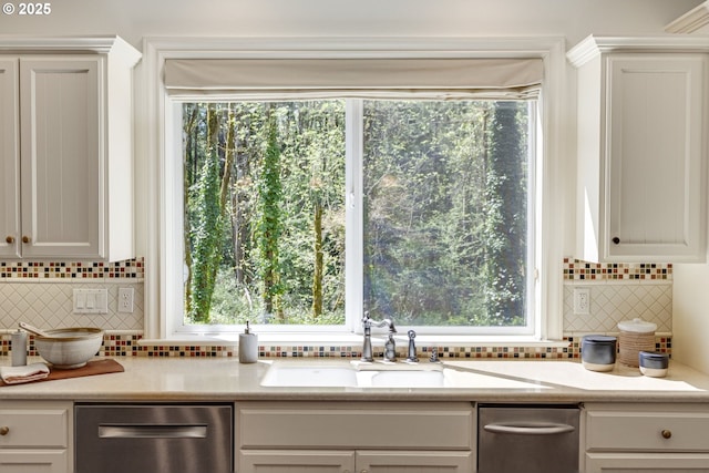 4054 Canal Woods Ct, Lake Oswego, OR 97034 - kitchen with plenty of natural light, stainless steel dishwasher, a sink, and backsplash