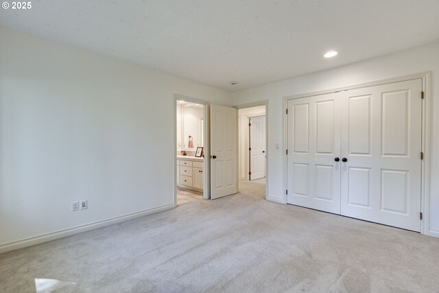 4054 Canal Woods Ct, Lake Oswego, OR 97034 - unfurnished bedroom with recessed lighting, a closet, baseboards, light colored carpet, and ensuite bathroom