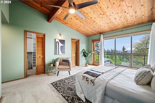 carpeted bedroom with vaulted ceiling with beams, wooden ceiling, ceiling fan, and baseboards