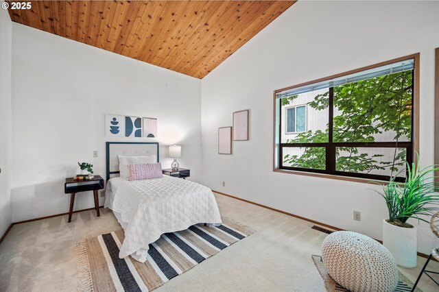 bedroom featuring visible vents, wood ceiling, carpet flooring, high vaulted ceiling, and baseboards