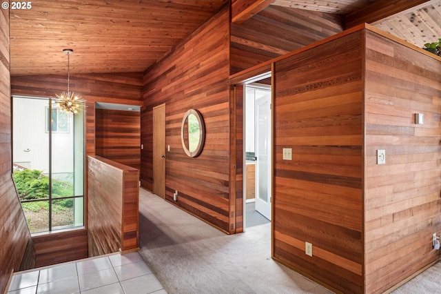 corridor featuring lofted ceiling, wood walls, and wood ceiling