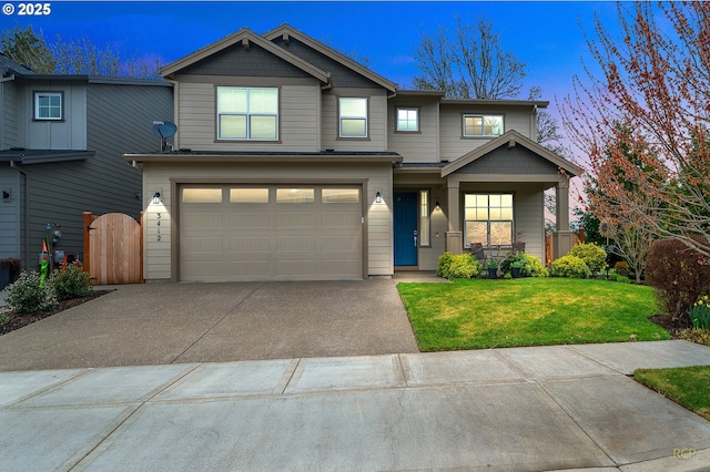 craftsman house with fence, a front yard, a garage, driveway, and a gate