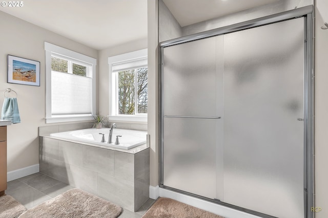 full bath featuring tile patterned floors, a stall shower, a bath, and vanity