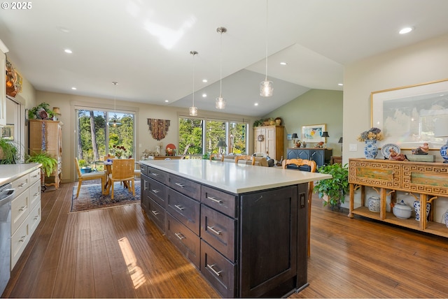 kitchen featuring white cabinets, light countertops, dark wood-style flooring, and a healthy amount of sunlight