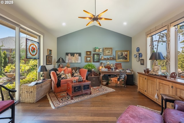 living room featuring ceiling fan, wood finished floors, lofted ceiling, and a healthy amount of sunlight