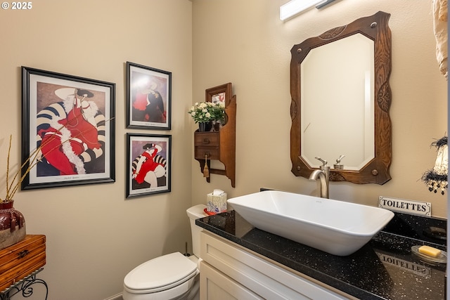 bathroom with toilet and vanity