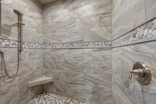 full bathroom featuring tiled shower