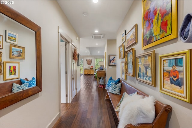 corridor with baseboards, recessed lighting, visible vents, and dark wood-style floors