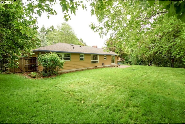 rear view of house featuring a chimney