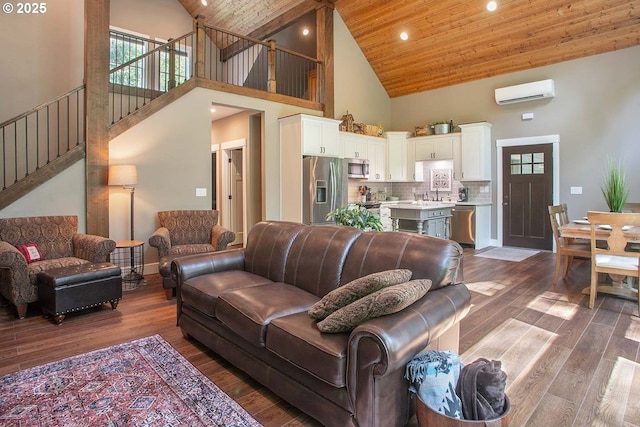 25815 NE Lucia Falls Rd, Yacolt, WA 98675 - living area featuring high vaulted ceiling, an AC wall unit, wooden ceiling, dark wood-style flooring, and stairway