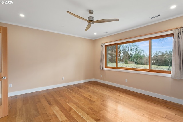 unfurnished room with recessed lighting, visible vents, baseboards, light wood-style floors, and ornamental molding