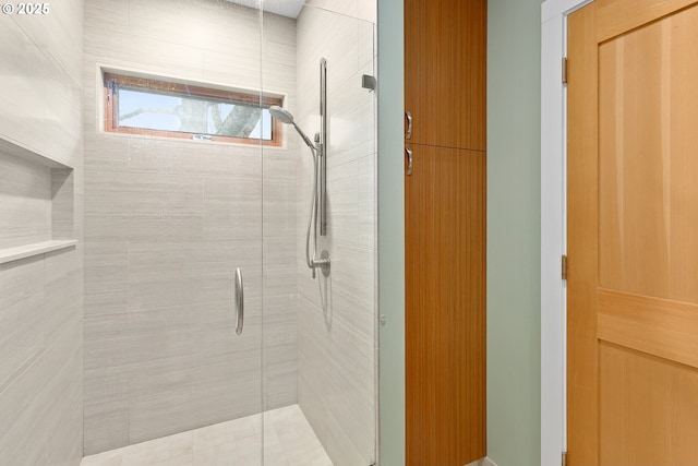 bathroom with a shower stall