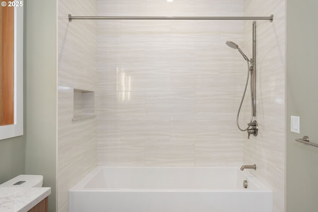 bathroom with vanity, shower / tub combination, and toilet