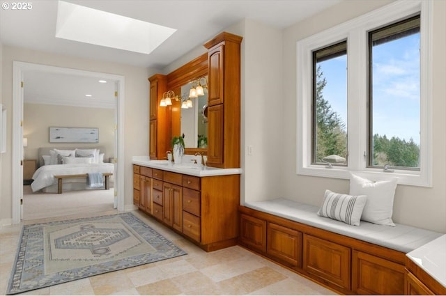 9440 NW Lightning Ridge Dr, Portland, OR 97229 - full bath featuring ensuite bathroom, a skylight, vanity, and plenty of natural light