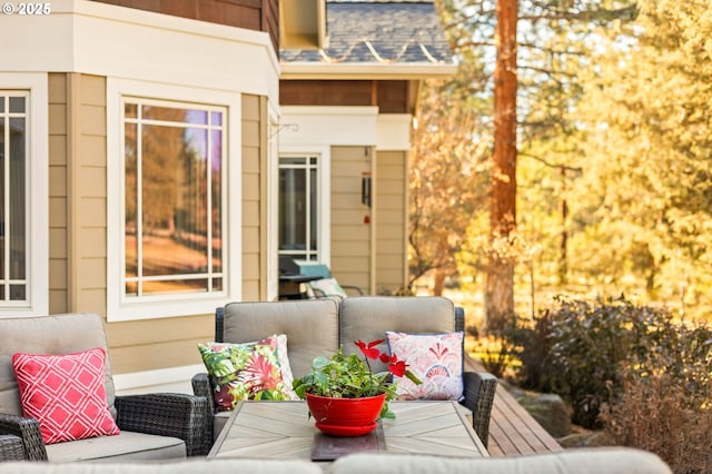 wooden terrace with outdoor lounge area