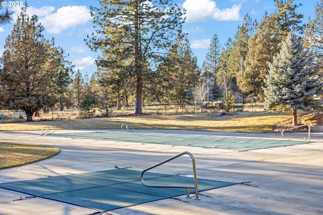 view of pool with fence