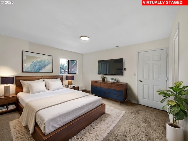 bedroom featuring baseboards and visible vents