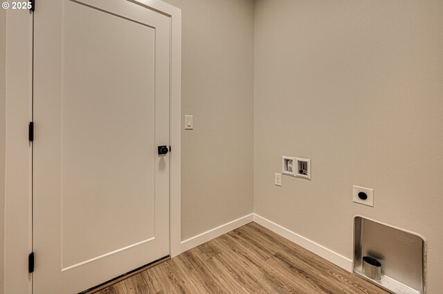washroom featuring baseboards, light wood-type flooring, washer hookup, and hookup for an electric dryer
