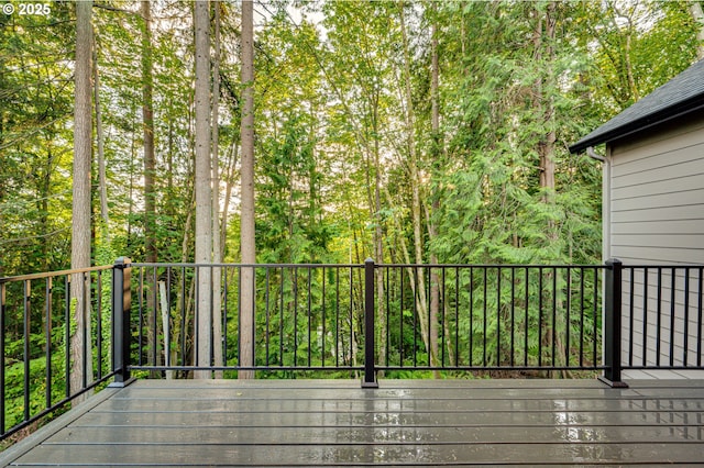 deck featuring a wooded view