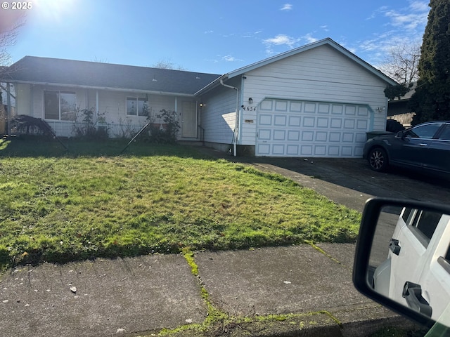 single story home featuring a garage and a front lawn