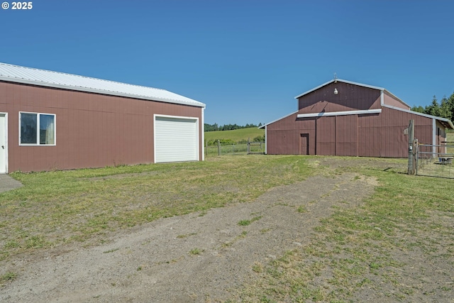 19587 NW Adcock Rd, Yamhill, OR 97148 - view of yard with a detached garage, an outbuilding, and a barn