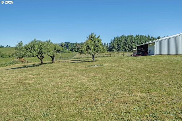 19587 NW Adcock Rd, Yamhill, OR 97148 - view of grassy yard featuring a pole building and an outbuilding
