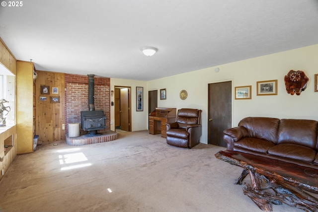 19587 NW Adcock Rd, Yamhill, OR 97148 - living area with a wood stove, carpet flooring, and wooden walls