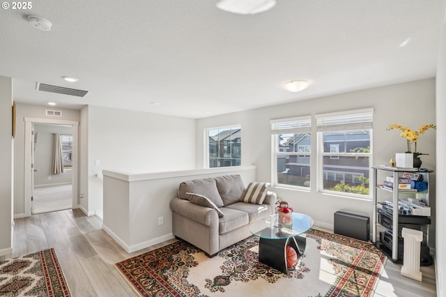 7623 SE Roaring Ln, Hillsboro, OR 97123 - living room featuring light wood-style floors and recessed lighting