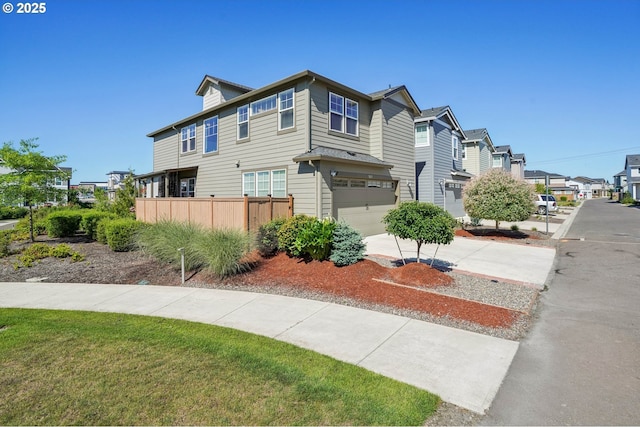 7623 SE Roaring Ln, Hillsboro, OR 97123 - view of property exterior featuring concrete driveway, a garage, and a residential view