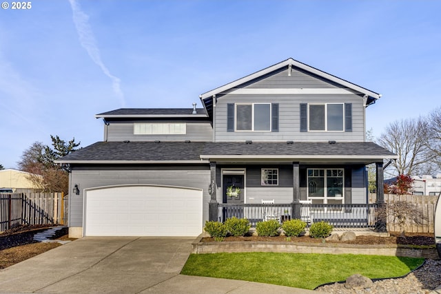 view of front facade with a garage and covered porch