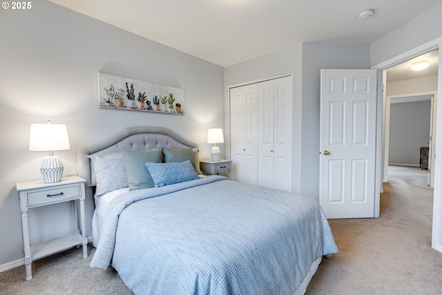 bedroom featuring light carpet and a closet