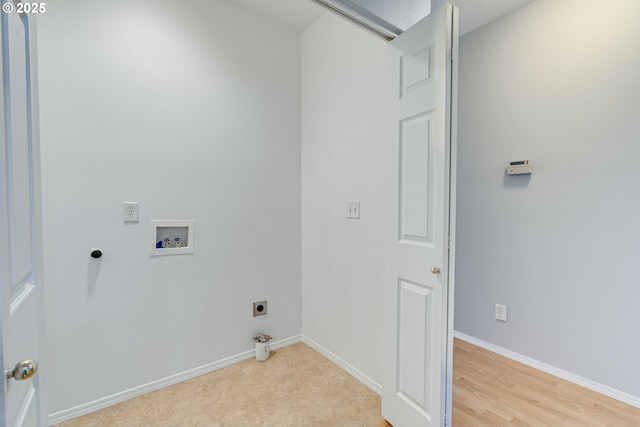 washroom with electric dryer hookup, washer hookup, and light hardwood / wood-style floors