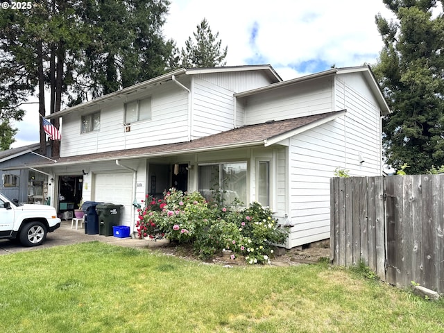view of front of property featuring an attached garage and driveway