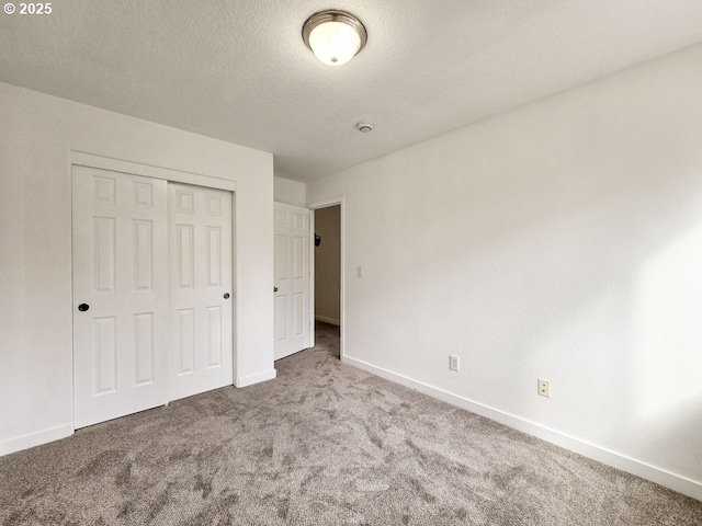 3547 SE 136th Ave, Portland, OR 97236 - unfurnished bedroom featuring carpet, baseboards, a closet, and a textured ceiling